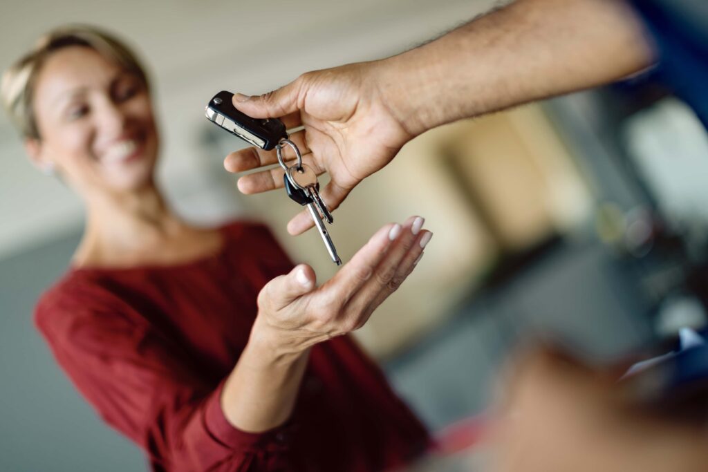 woman being handed car keys