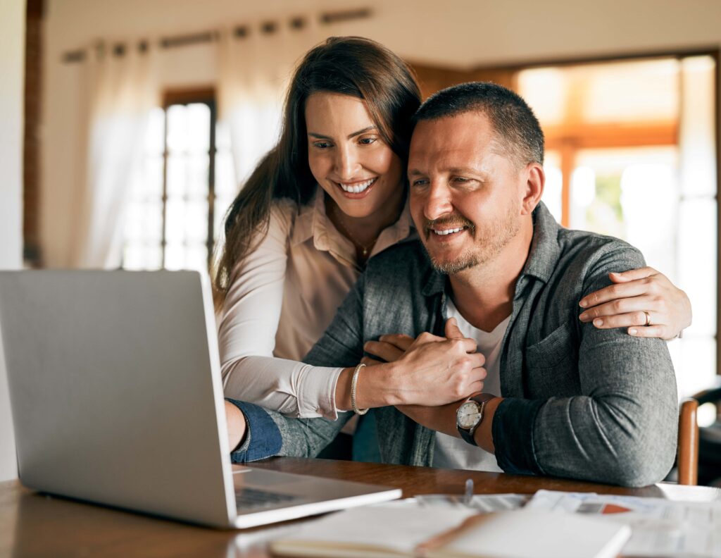 a happy couple obtaining insurance