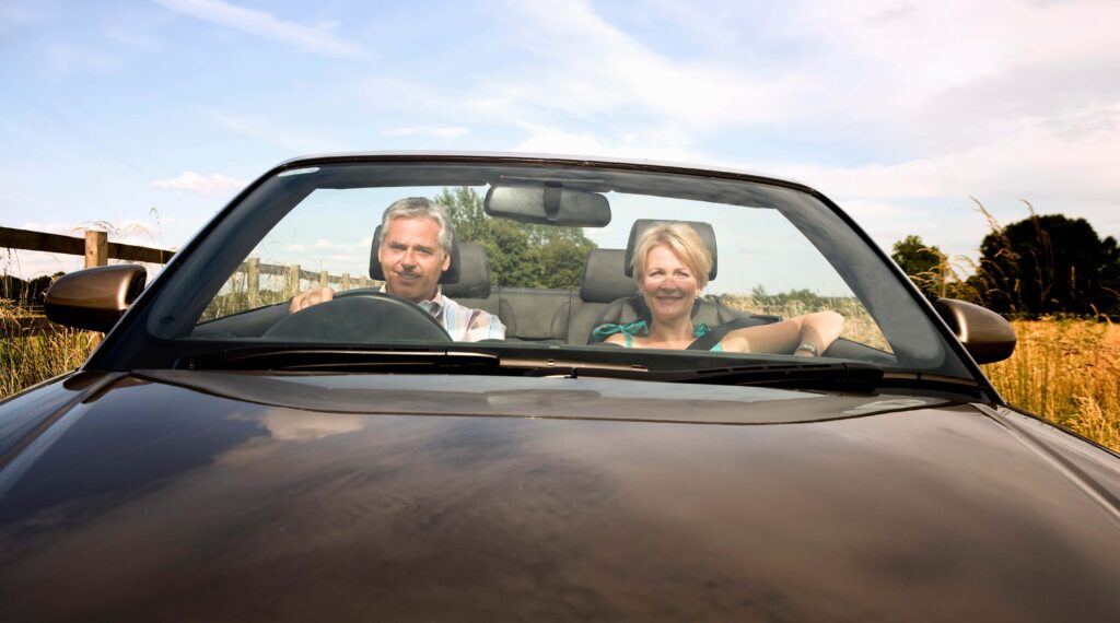 old couple driving in the countryside