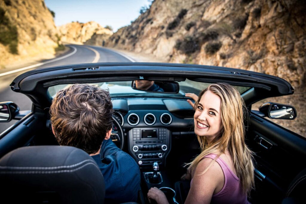 Couple in car on a road trip in the UK