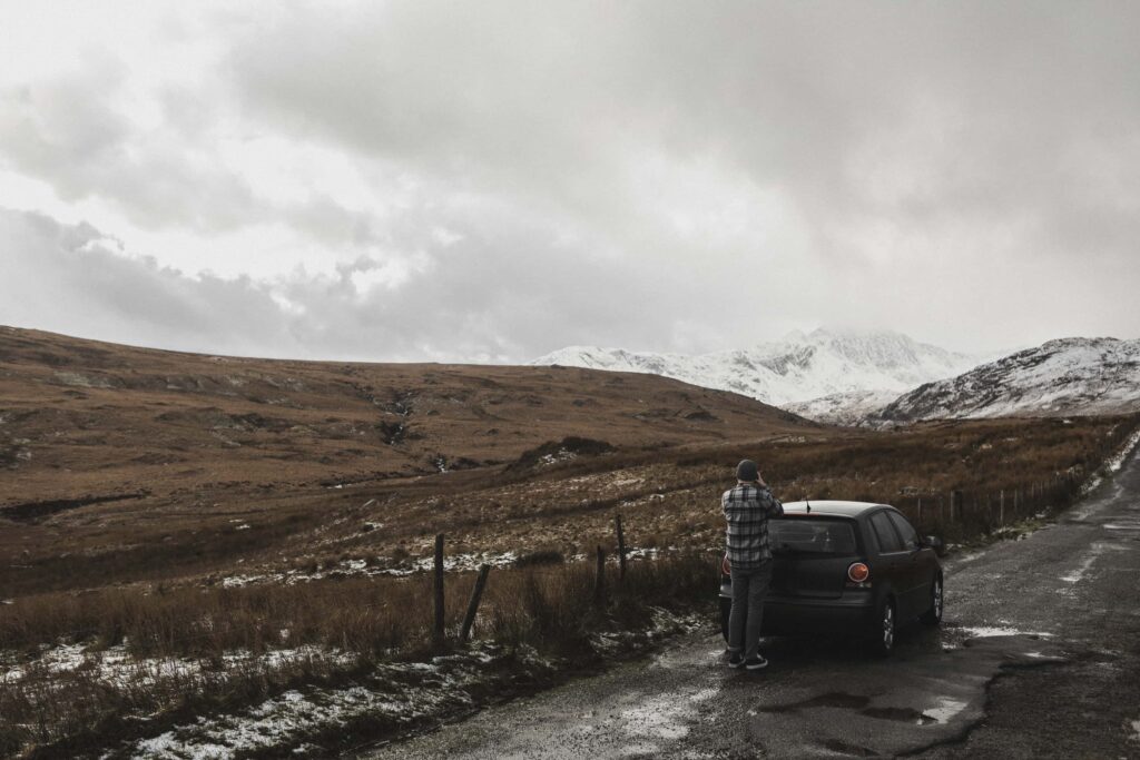 person taking a photo of Snowdonia 